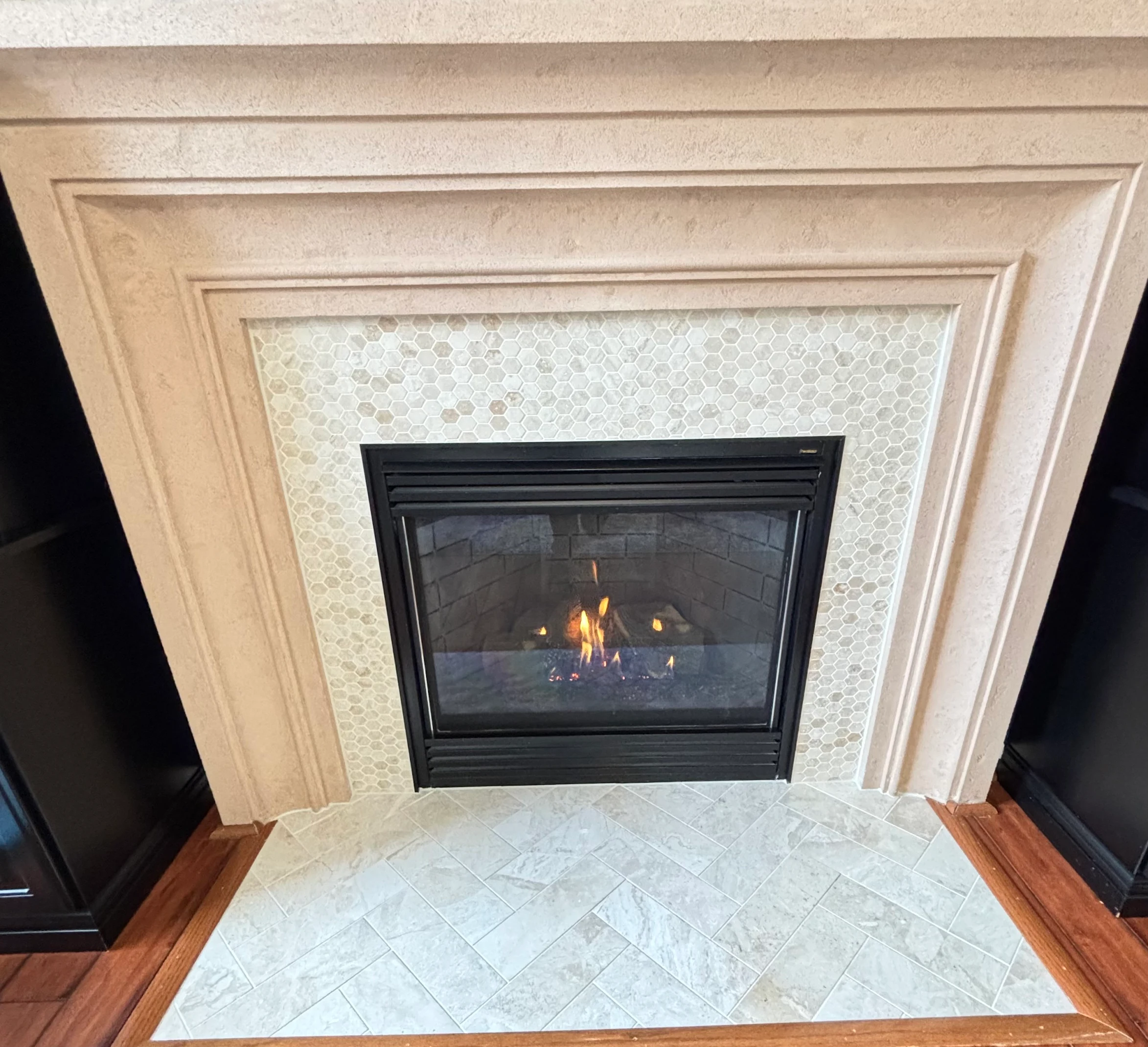 White fireplace with custom brickwork